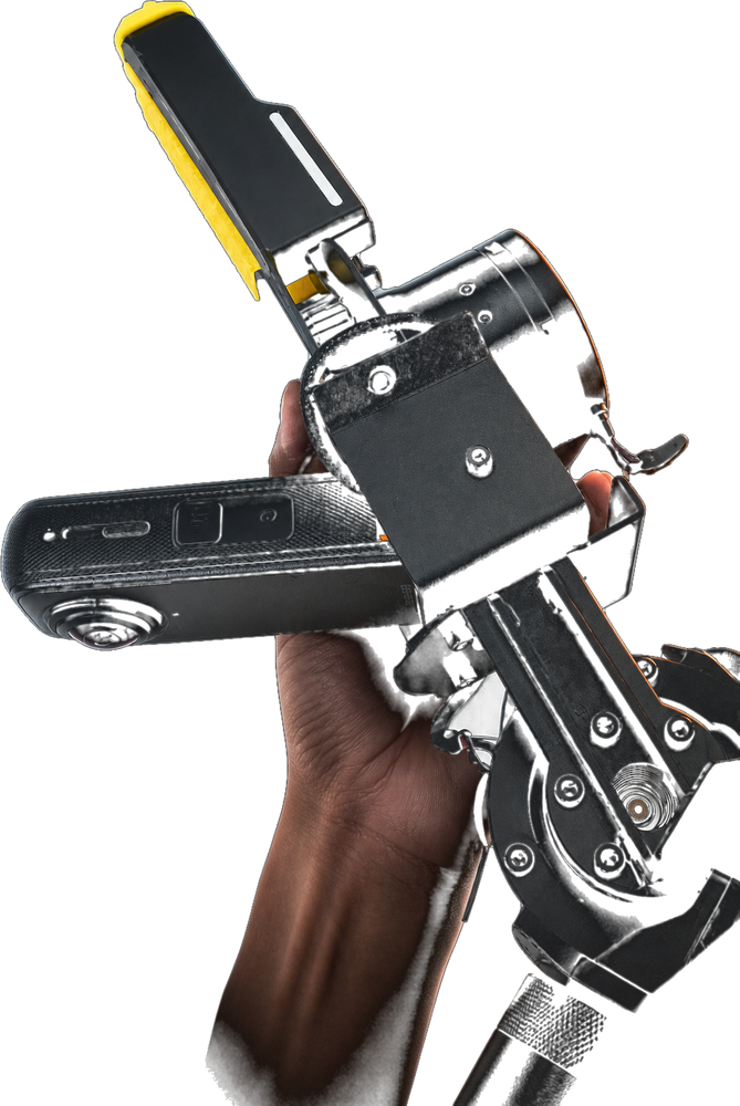 A hand holding the rig by its handle